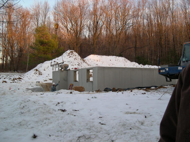 Installing the prefab foundation walls.